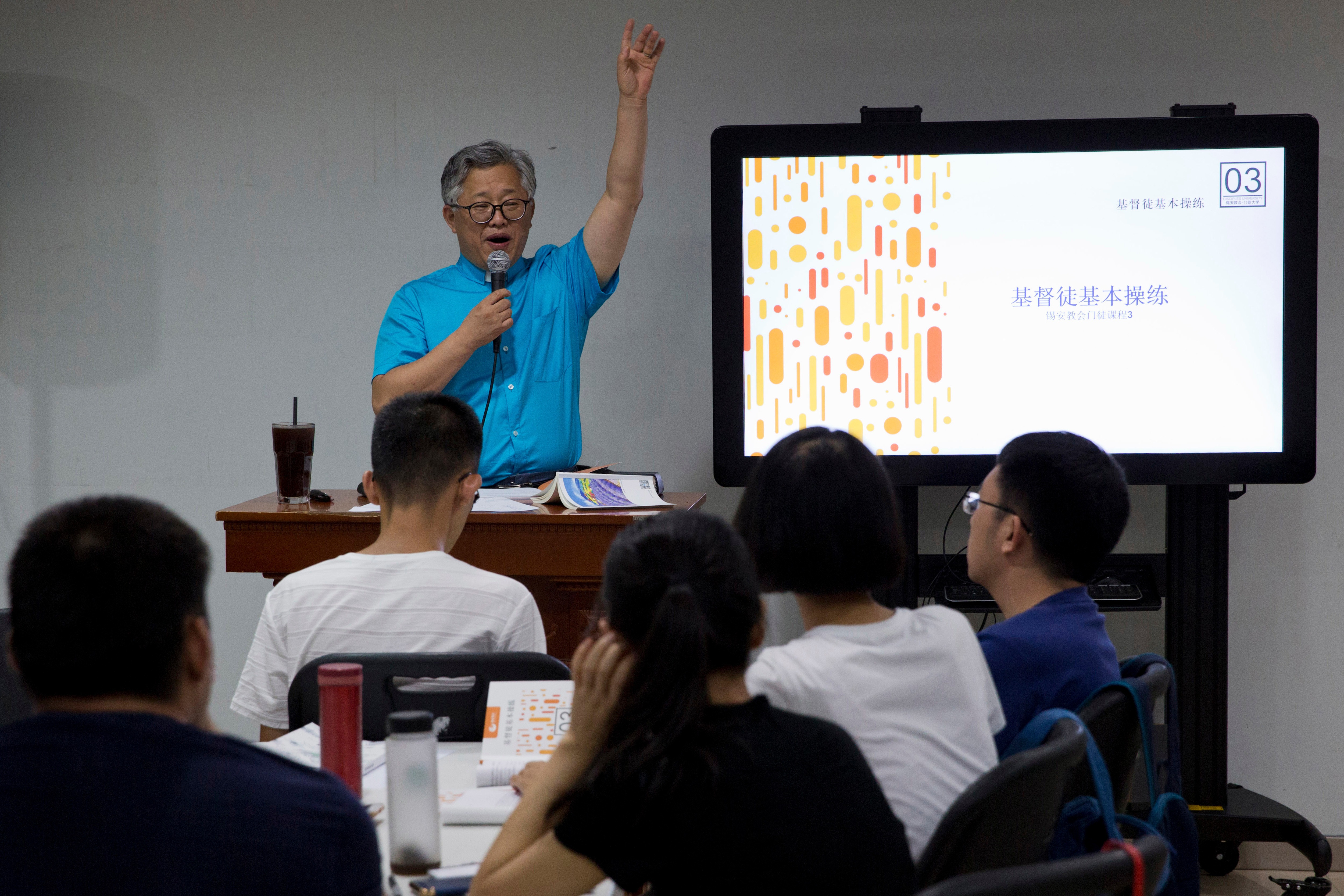 Pastor Ezra Jin leads a class on the basics of Christian beliefs at the Zion Church in Beijing, China, in August 2018.